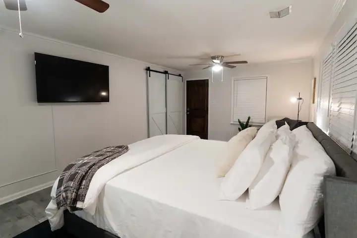 3506 McCorkle Road Memphis, TN 38116 - Photo 6 of 12 a bedroom with a bed and a flat screen tv