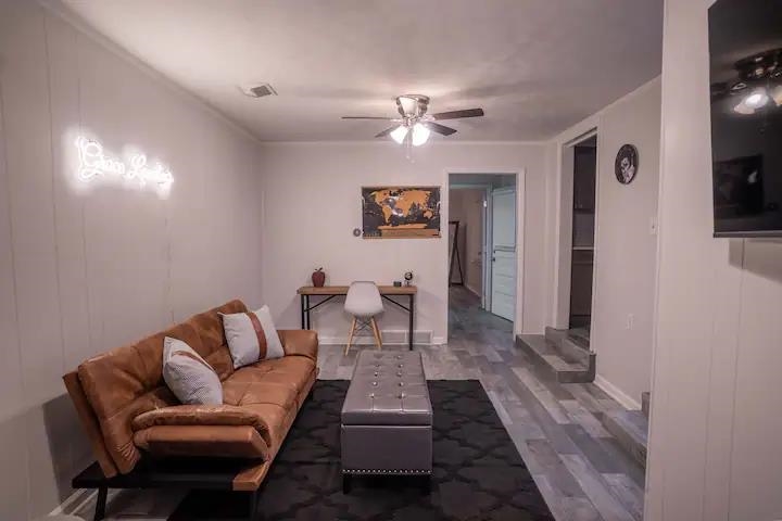 3506 McCorkle Road Memphis, TN 38116 - Photo 10 of 12 a living room with furniture a flat screen tv and a ceiling fan