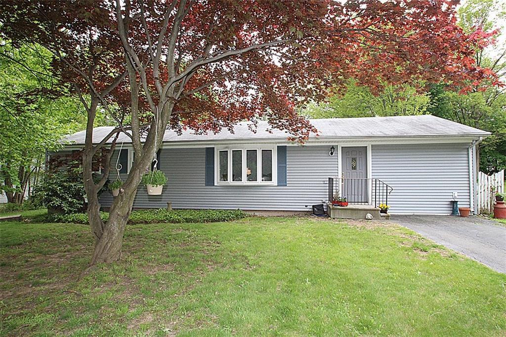 64 Ridgecrest Road Wallingford, CT 06492 - Photo 1 of 1 a backyard of a house with table and chairs