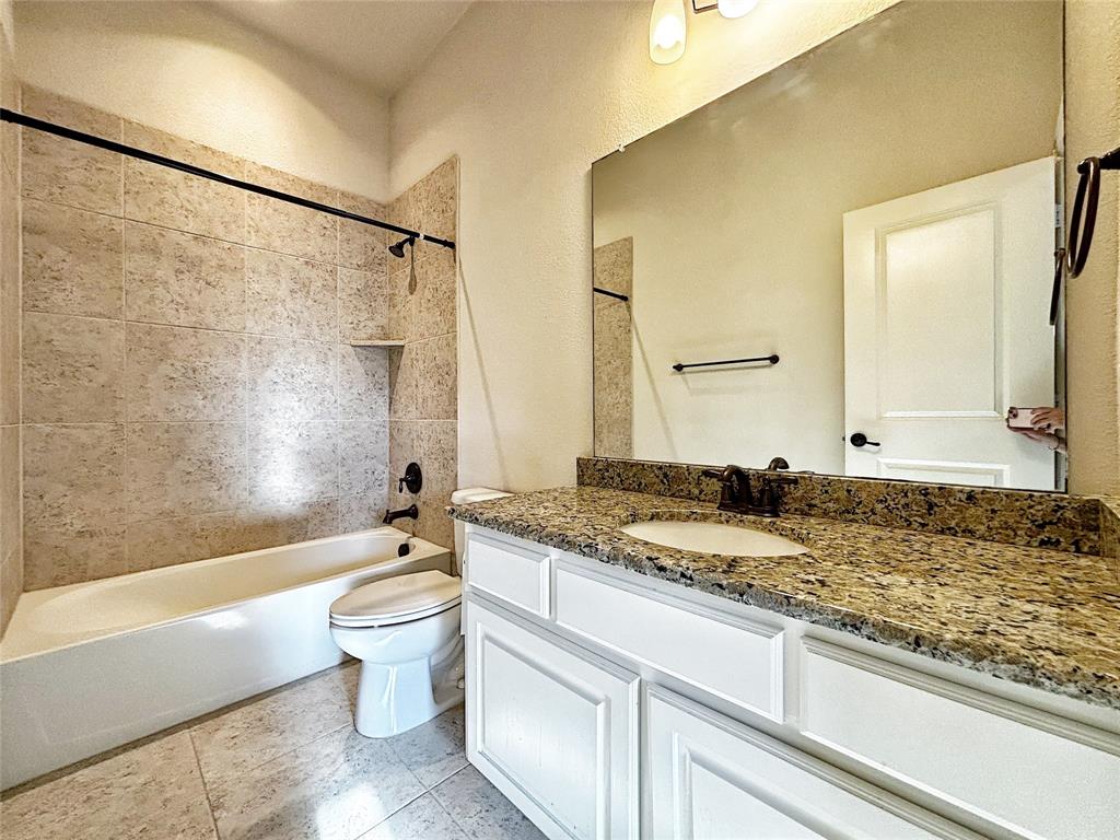 3037 Crestwater Ridge Keller, TX 76248 - Photo 19 of 25 a bathroom with a granite countertop sink mirror vanity and toilet