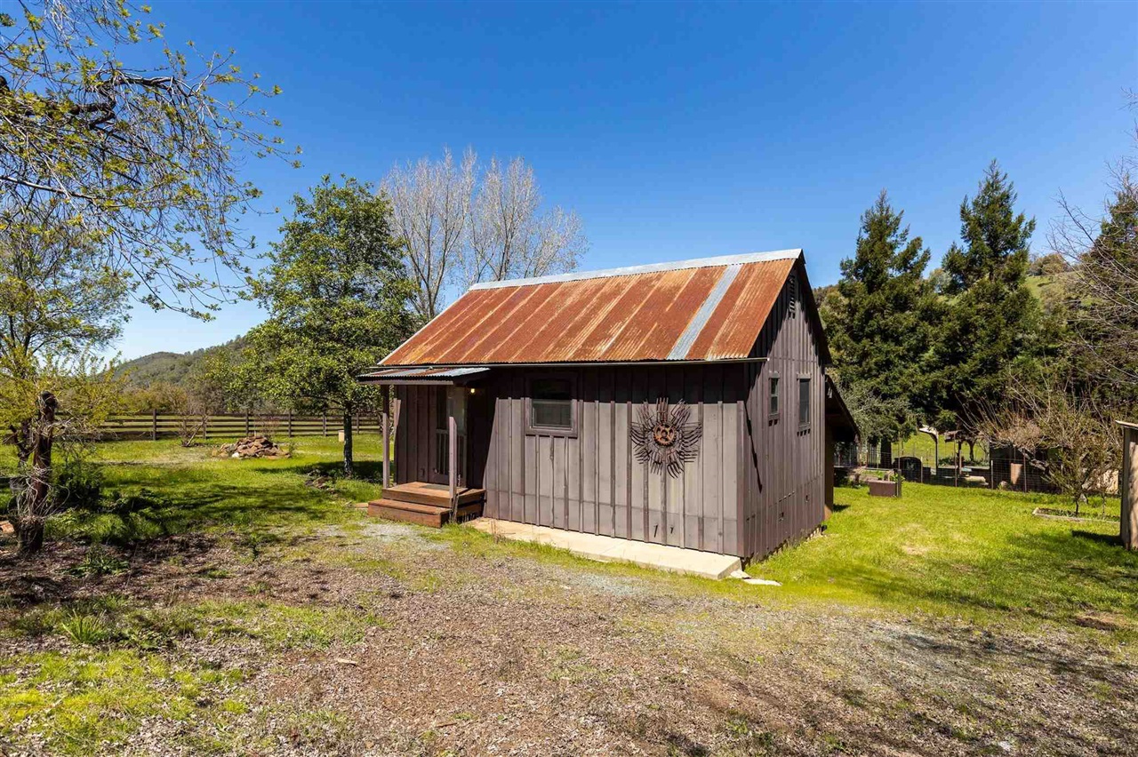 16554 Cocoran Gray Road Groveland, CA 95321 - Photo 30 of 38 View of outdoor structure with a rural view and a lawn