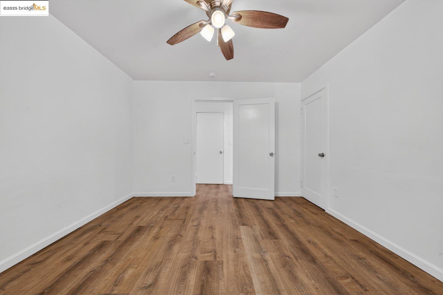 1408 Berkeley Way Berkeley, CA 94702 - Photo 12 of 22 a view of empty room with wooden floor