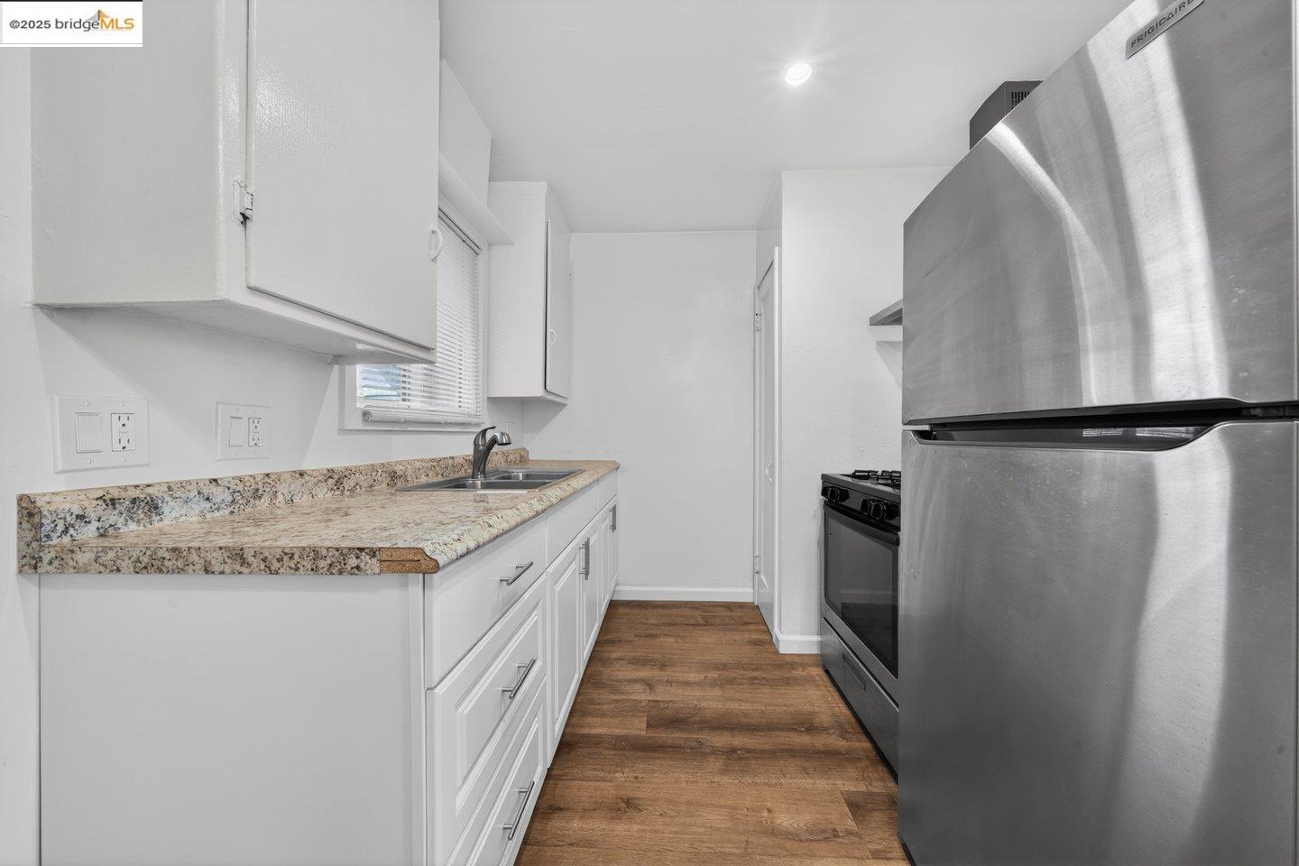 1408 Berkeley Way Berkeley, CA 94702 - Photo 13 of 22 a kitchen with stainless steel appliances granite countertop a refrigerator and a sink