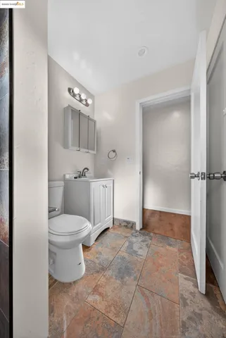 a spacious bathroom with a toilet and a shower