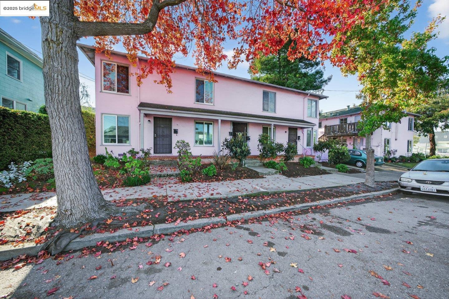 1408 Berkeley Way Berkeley, CA 94702 - Photo 2 of 22 a front view of a house with a yard