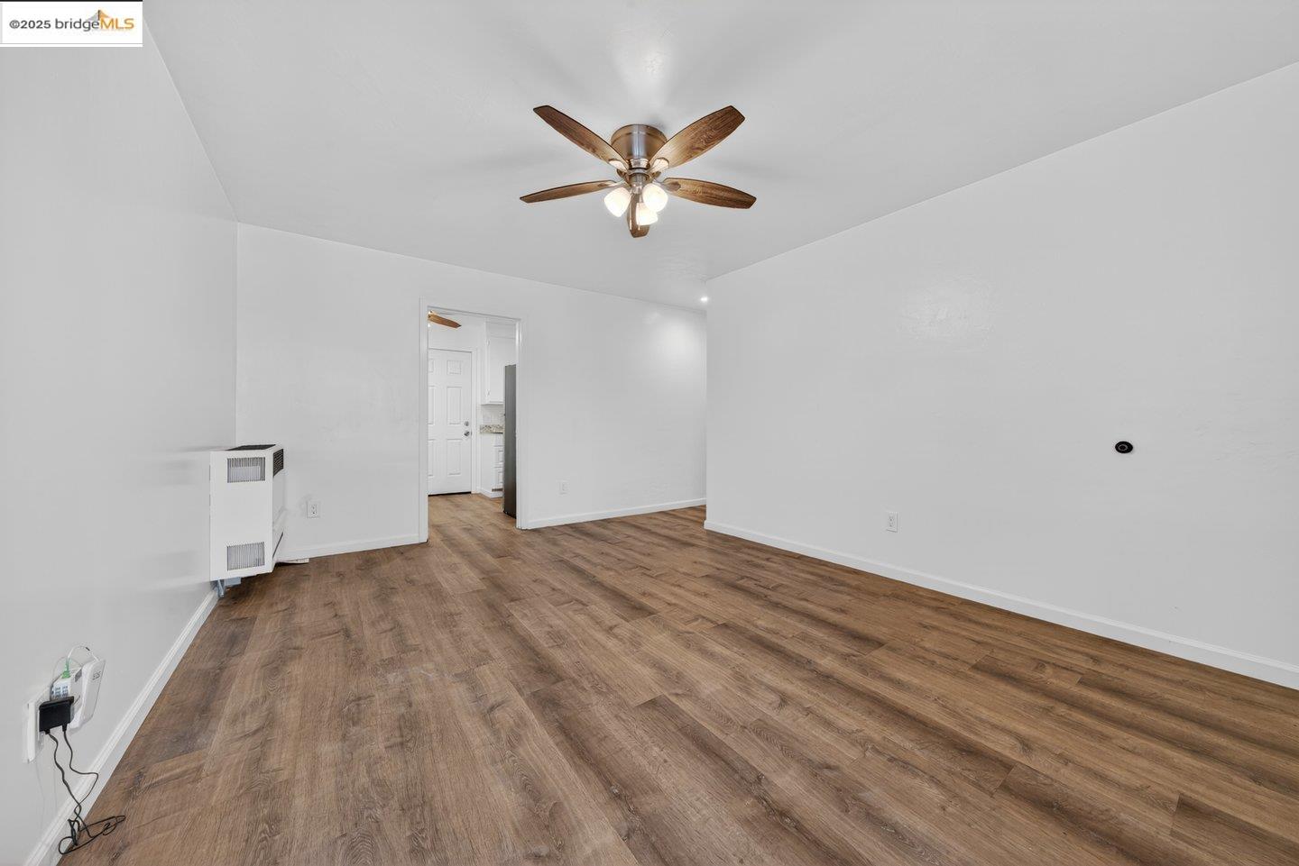 1408 Berkeley Way Berkeley, CA 94702 - Photo 4 of 22 a view of empty room with wooden floor