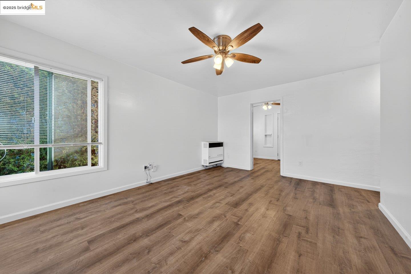 1408 Berkeley Way Berkeley, CA 94702 - Photo 5 of 22 a view of empty room with wooden floor and window
