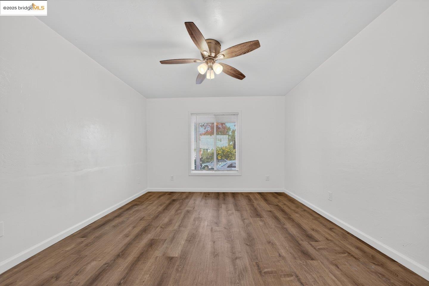 1408 Berkeley Way Berkeley, CA 94702 - Photo 6 of 22 a view of room with window ceiling fan and wooden floor