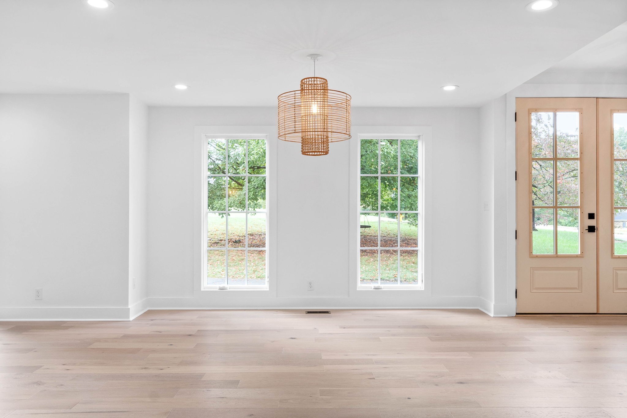 493 Georgetown Road Clarksville, TN 37043 - Photo 12 of 42 a view of an empty room with wooden floor and windows
