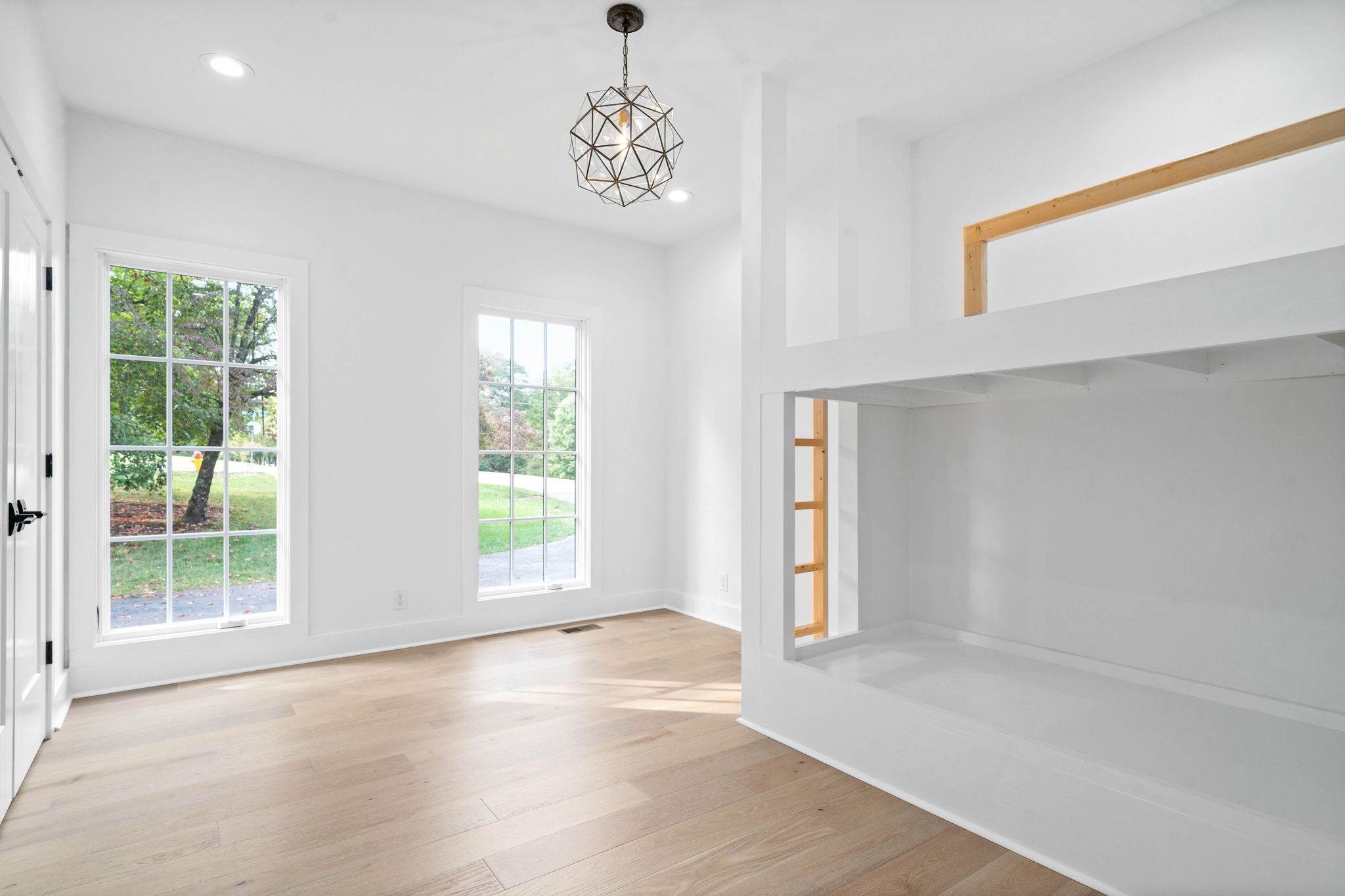 493 Georgetown Road Clarksville, TN 37043 - Photo 20 of 42 a view of an empty room with wooden floor and a window