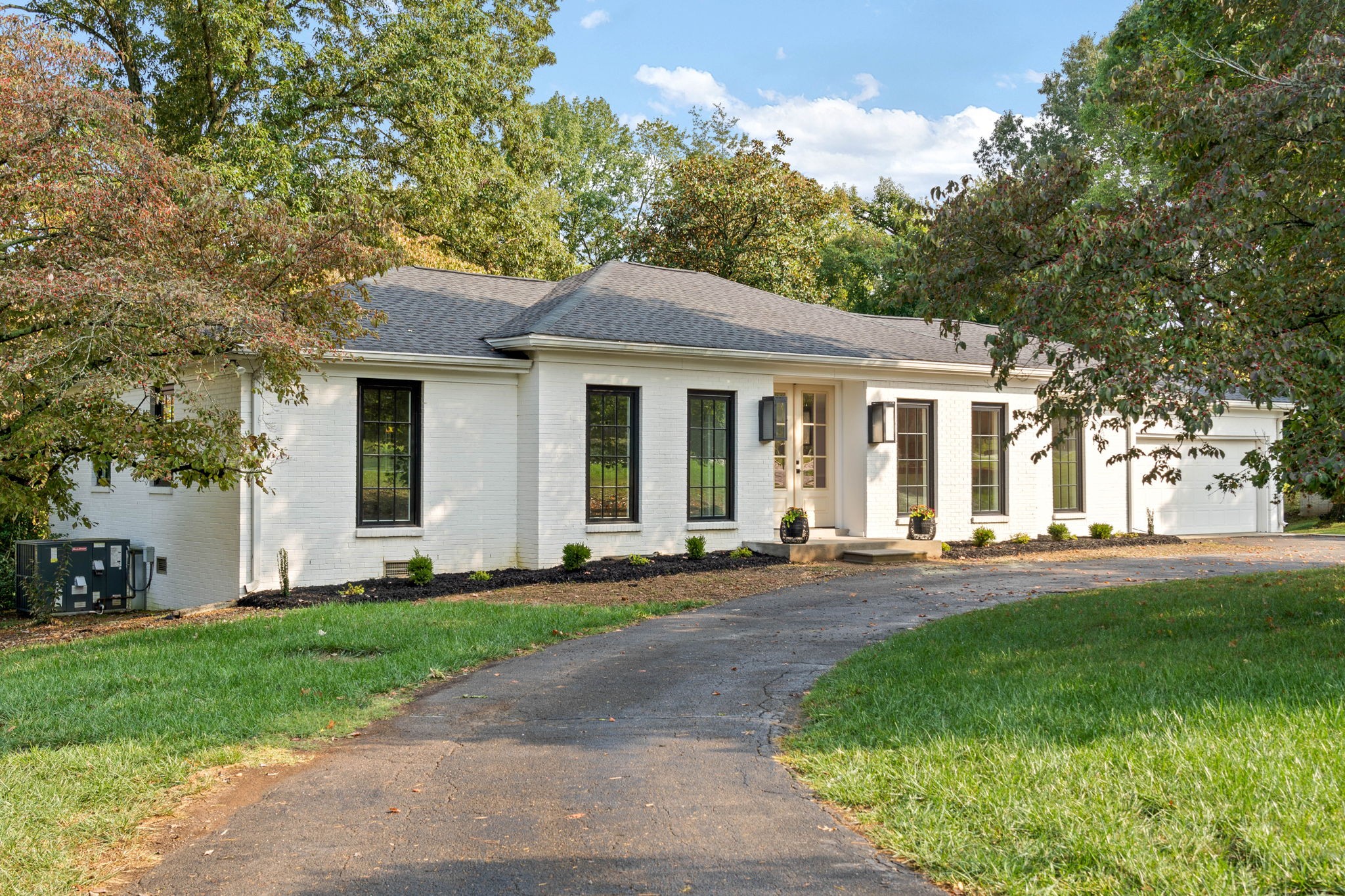 493 Georgetown Road Clarksville, TN 37043 - Photo 2 of 42 a front view of a house with a yard and trees