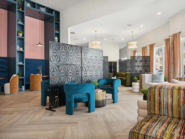 a large room with furniture and a large window