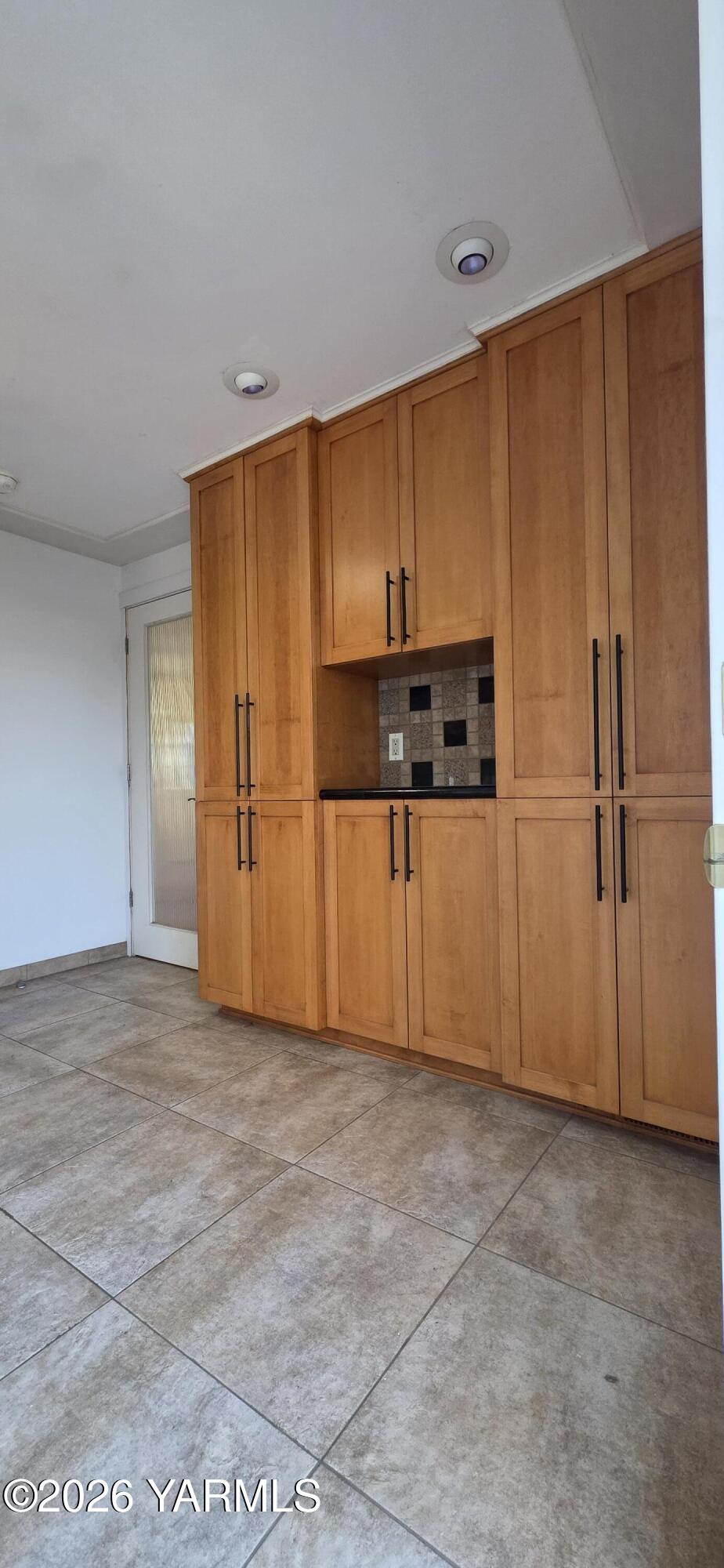 8601 Scenic Drive Yakima, WA 98908 - Photo 12 of 52 a view of a kitchen with refrigerator and wooden cabinets