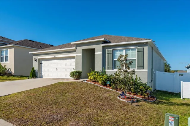 front view of a house with a yard