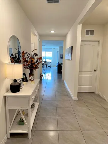 a view of a living room and entryway
