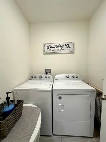 a utility room with dryer and washer