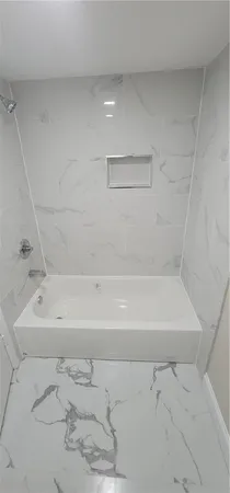 a bathroom with a bathtub