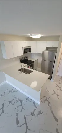 a bedroom with a bed and cabinets