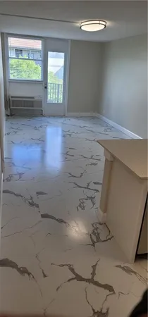 a view of room with window and hardwood floor