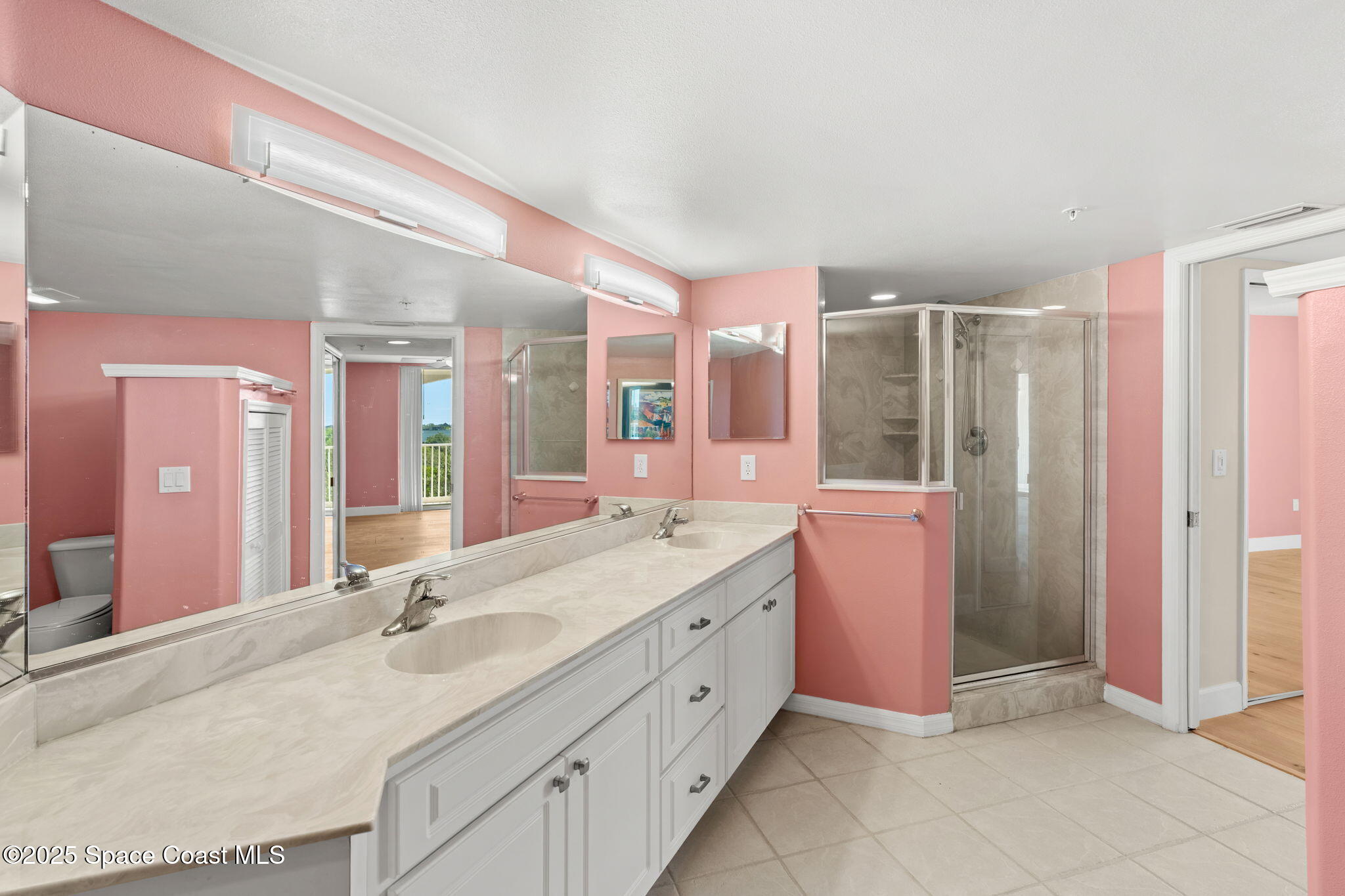 800 Del Rio Way, Unit 401 Merritt Island, FL 32953 - Photo 20 of 45 a bathroom with a double vanity sink mirror and double