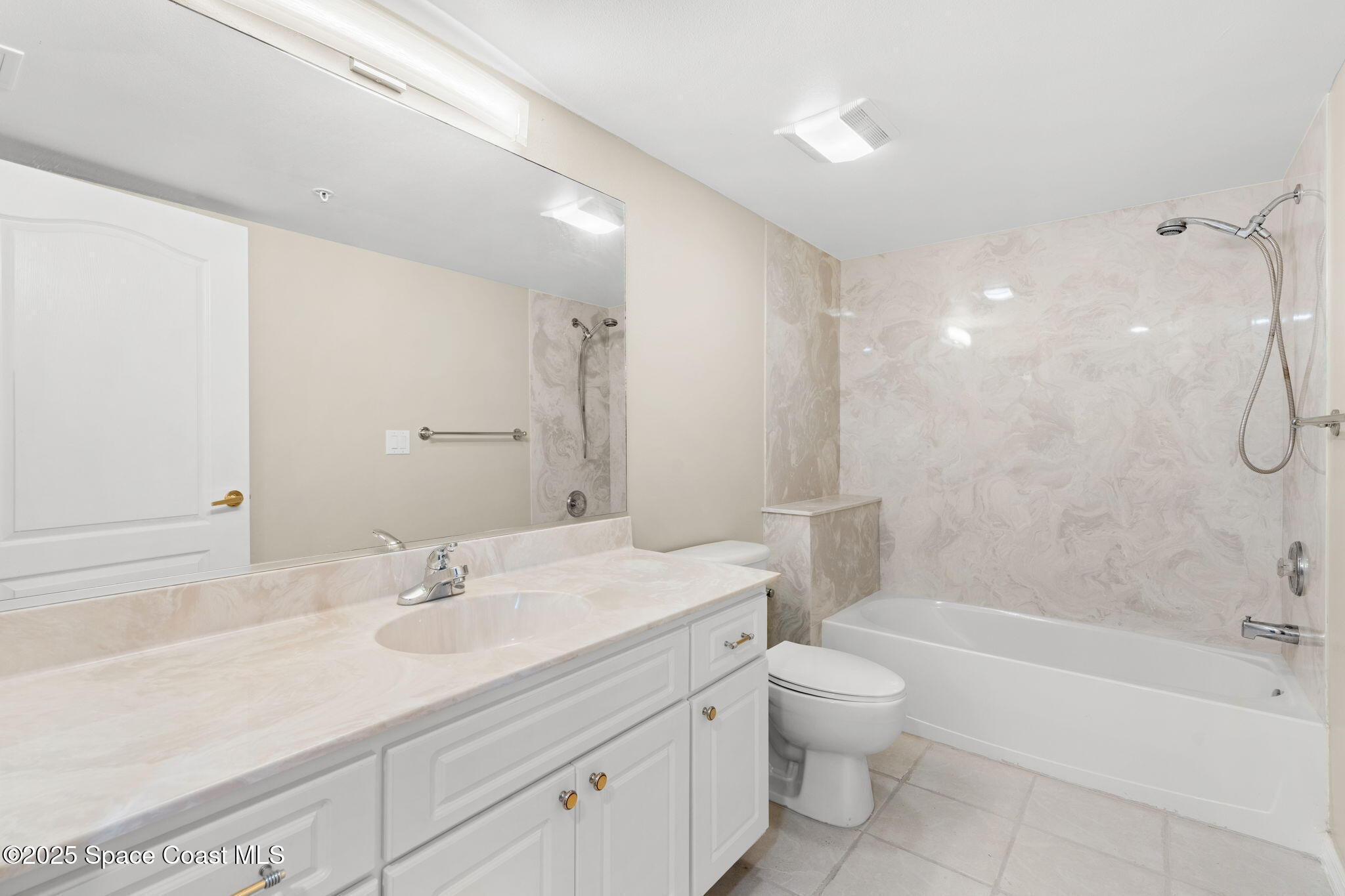 800 Del Rio Way, Unit 401 Merritt Island, FL 32953 - Photo 23 of 45 a bathroom with a sink a toilet and shower