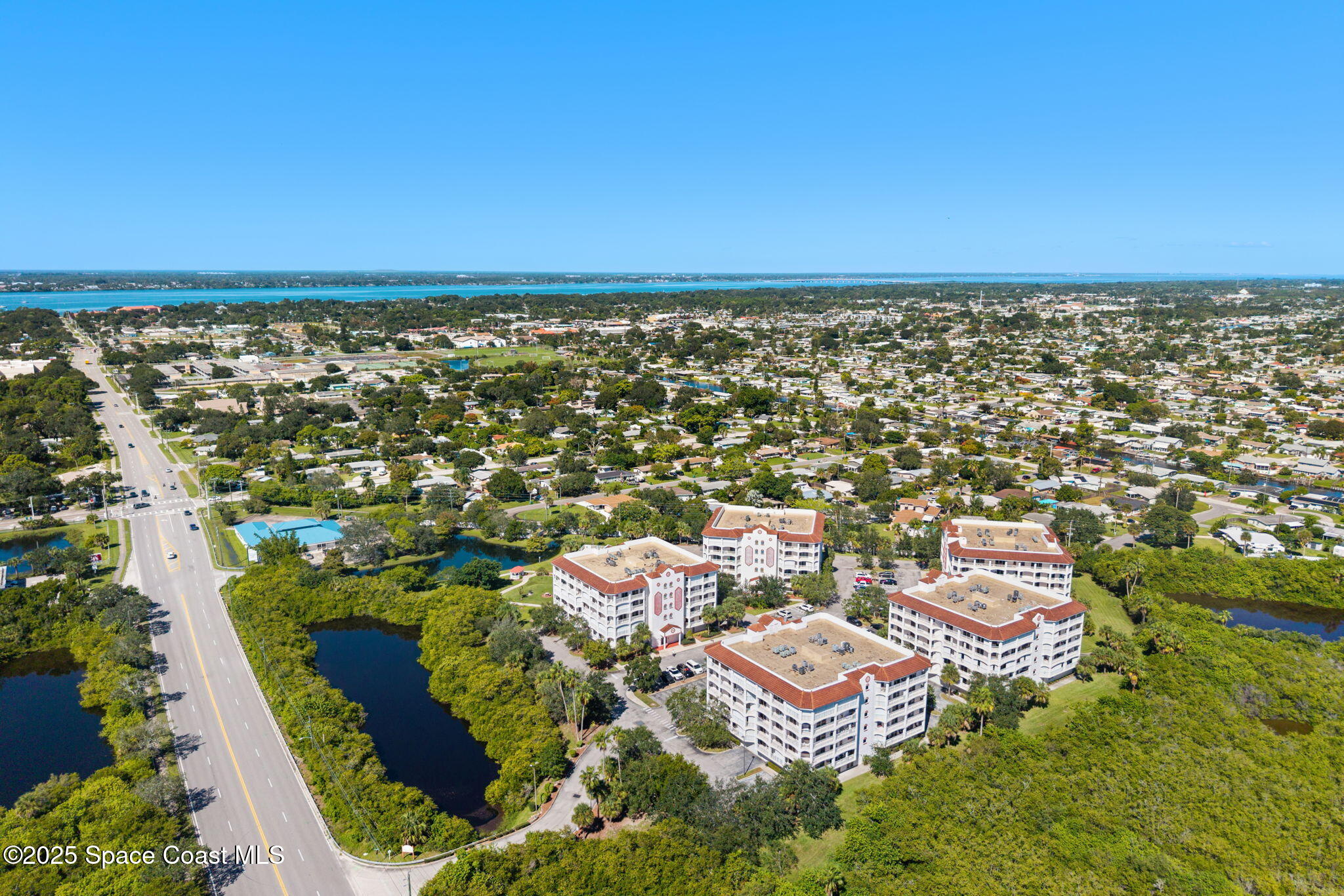 800 Del Rio Way, Unit 401 Merritt Island, FL 32953 - Photo 39 of 45 an aerial view of residential houses with outdoor space