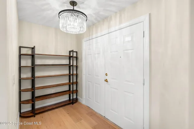 a view of a hallway with closet