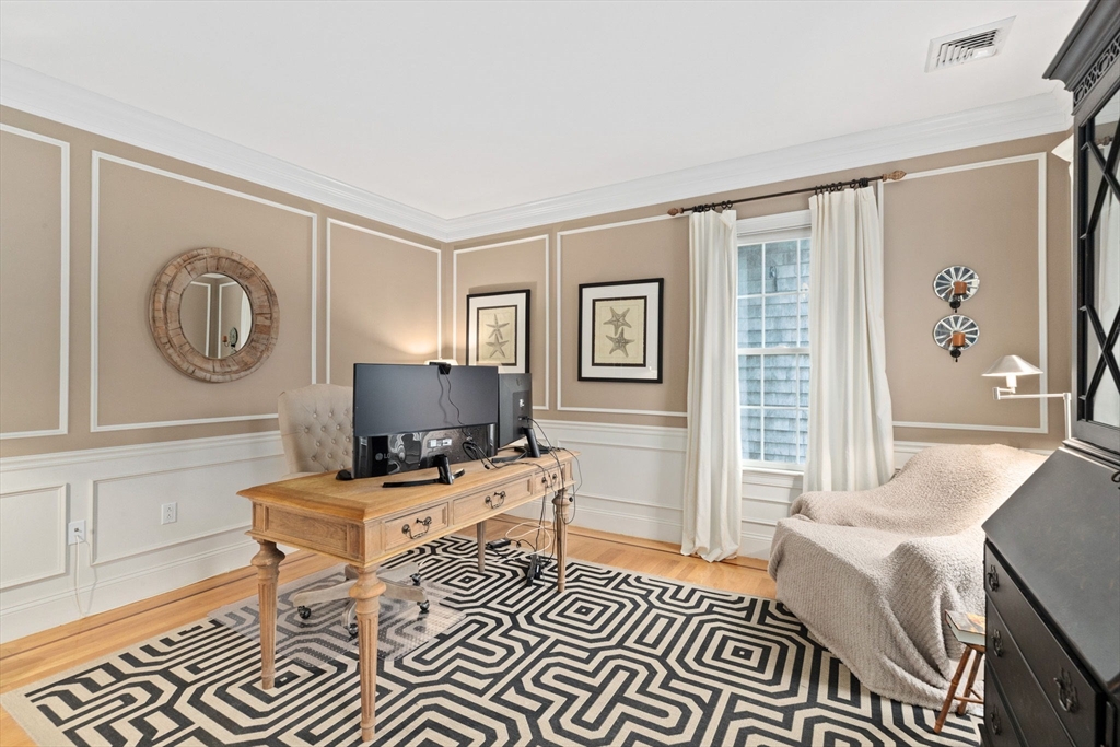 151 Tilden Road Scituate, MA 02066 - Photo 11 of 35 a living room with furniture a clock on wall and a window