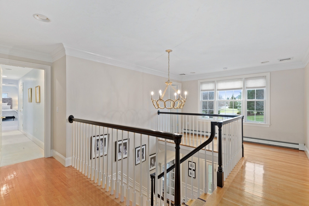 151 Tilden Road Scituate, MA 02066 - Photo 12 of 35 a view of entryway and hall with wooden floor