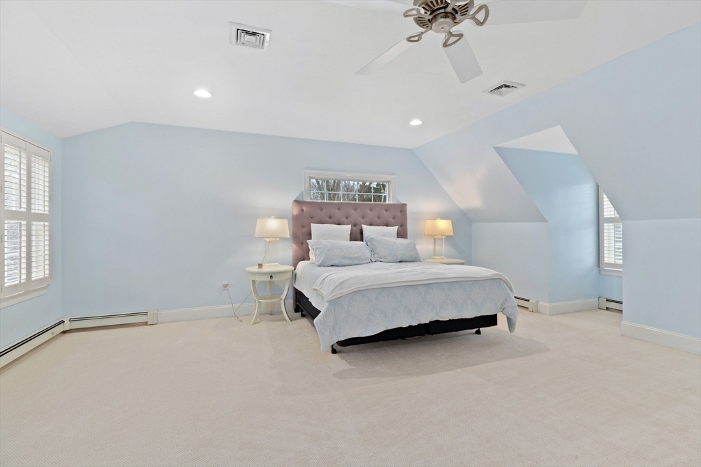 151 Tilden Road Scituate, MA 02066 - Photo 14 of 35 a bedroom with a bed and a ceiling fan