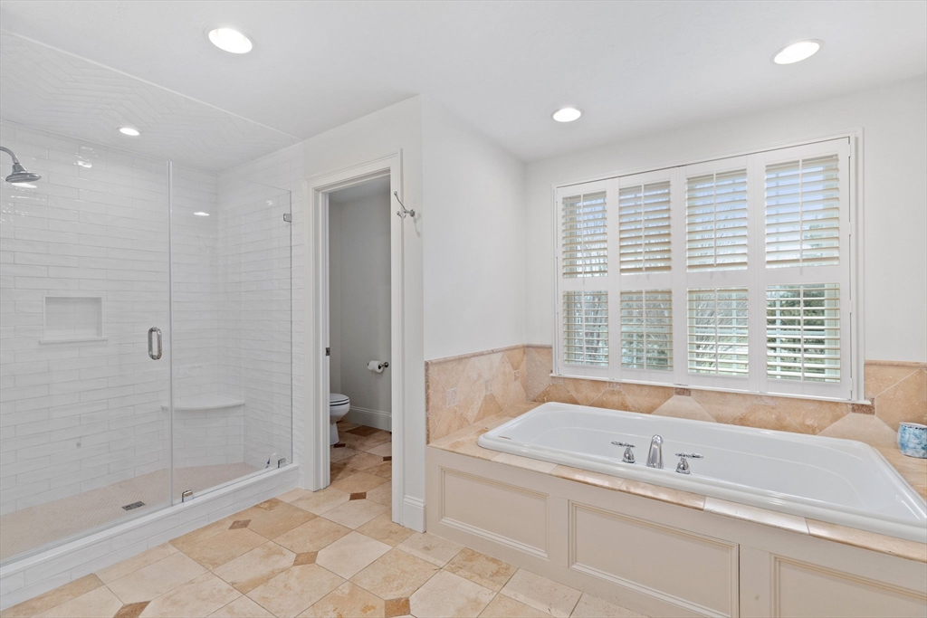 151 Tilden Road Scituate, MA 02066 - Photo 15 of 35 a bathroom with a bathtub and a shower