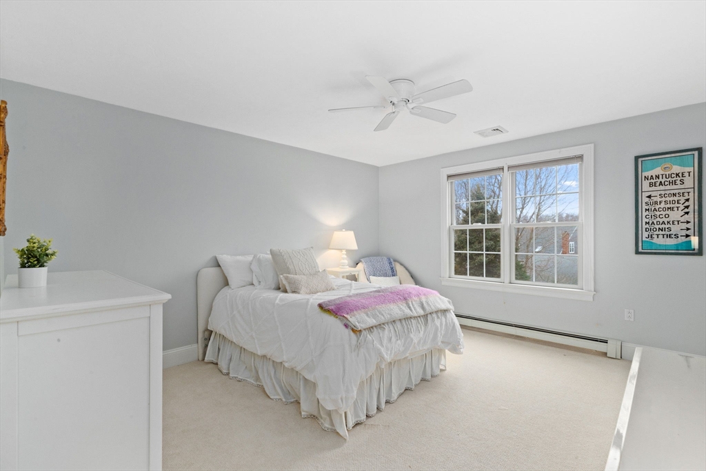 151 Tilden Road Scituate, MA 02066 - Photo 18 of 35 a bedroom with a bed and a window