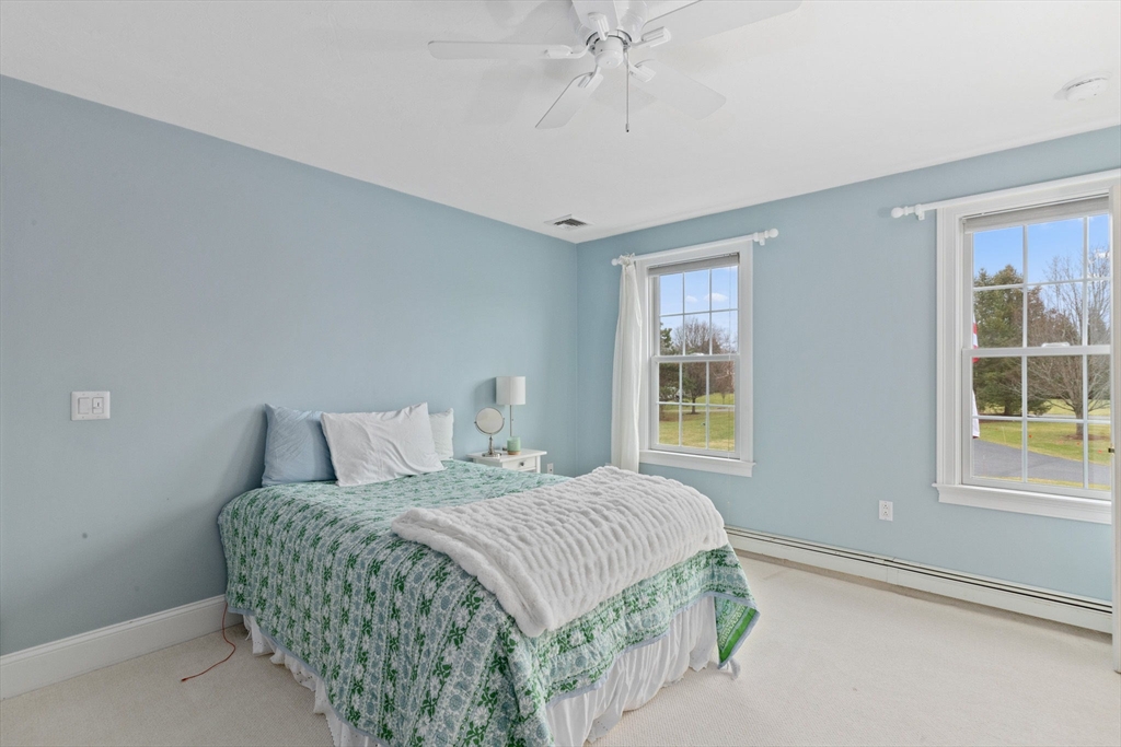 151 Tilden Road Scituate, MA 02066 - Photo 20 of 35 a bedroom with a bed and a window