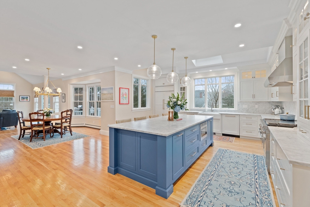 151 Tilden Road Scituate, MA 02066 - Photo 2 of 35 a kitchen with stainless steel appliances granite countertop sink wooden cabinets and counter top space