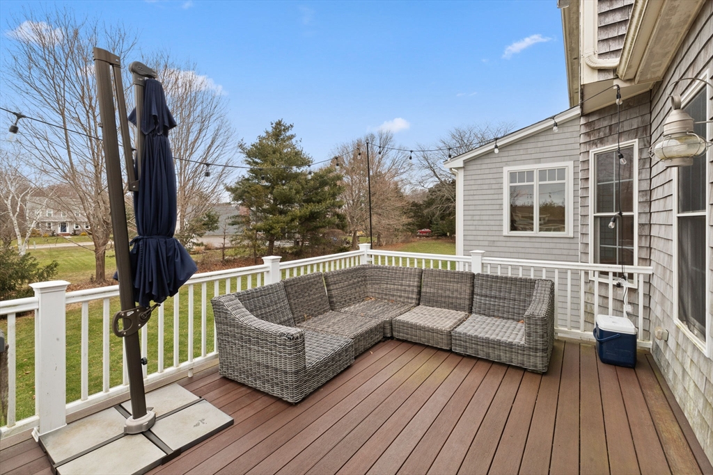 151 Tilden Road Scituate, MA 02066 - Photo 25 of 35 a balcony with furniture and wooden floor