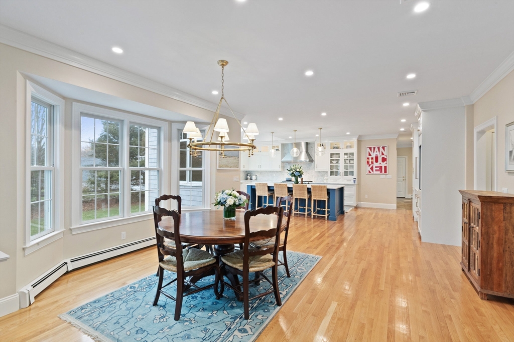 151 Tilden Road Scituate, MA 02066 - Photo 6 of 35 a dining room with furniture and wooden floor