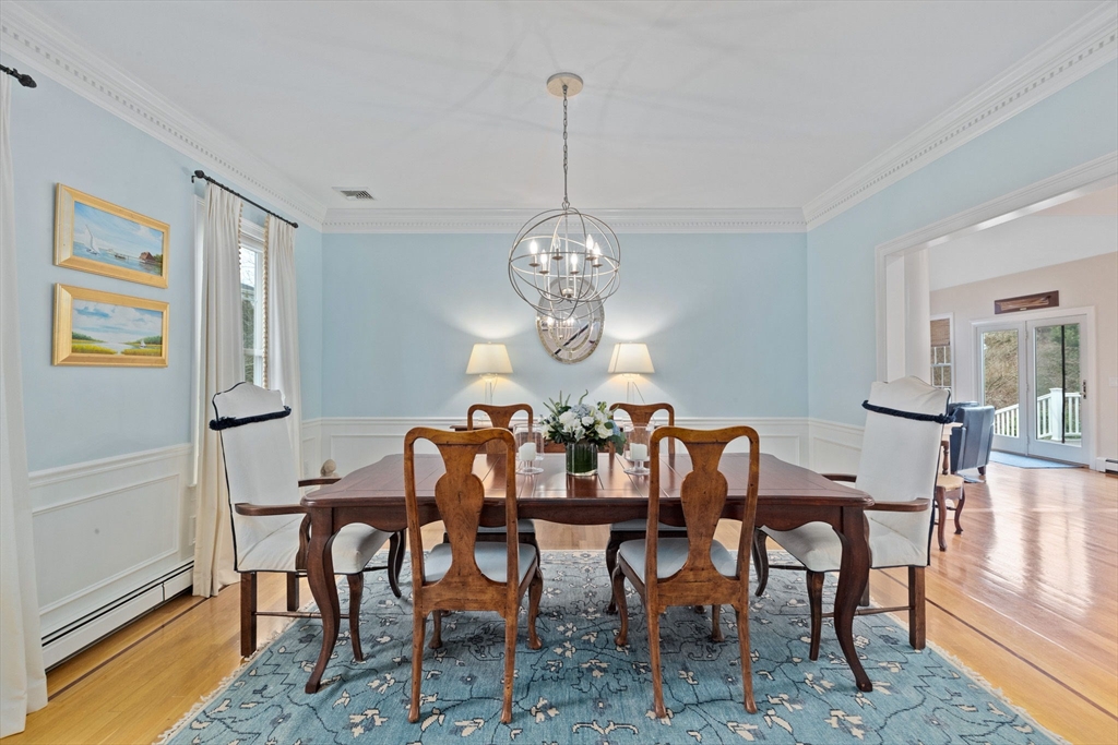 151 Tilden Road Scituate, MA 02066 - Photo 9 of 35 a view of a dining room with furniture window and wooden floor