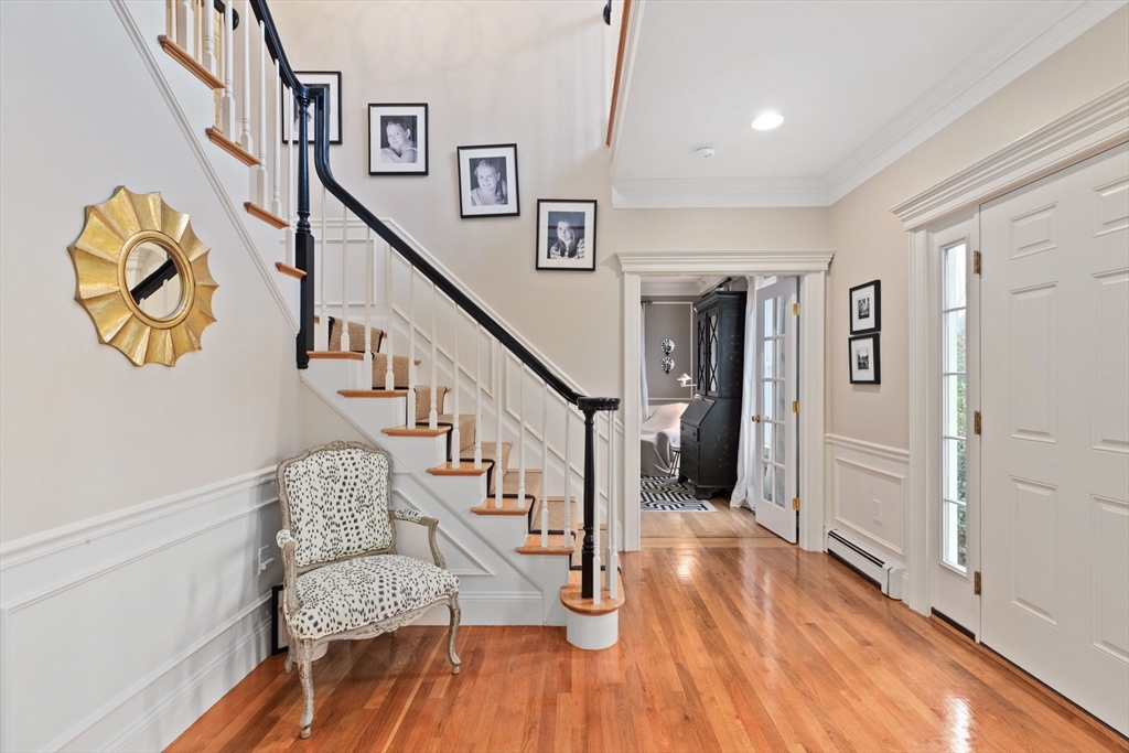 151 Tilden Road Scituate, MA 02066 - Photo 10 of 35 a view of entryway and hall with wooden floor
