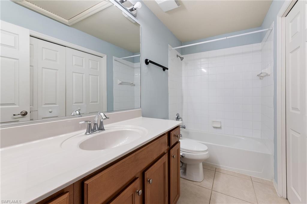 12010 Rock Brook Run, Unit 1704 Fort Myers, FL 33913 - Photo 11 of 17 a bathroom with a sink a toilet and shower