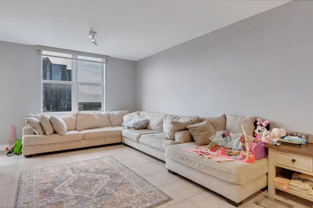 a living room with furniture and a window