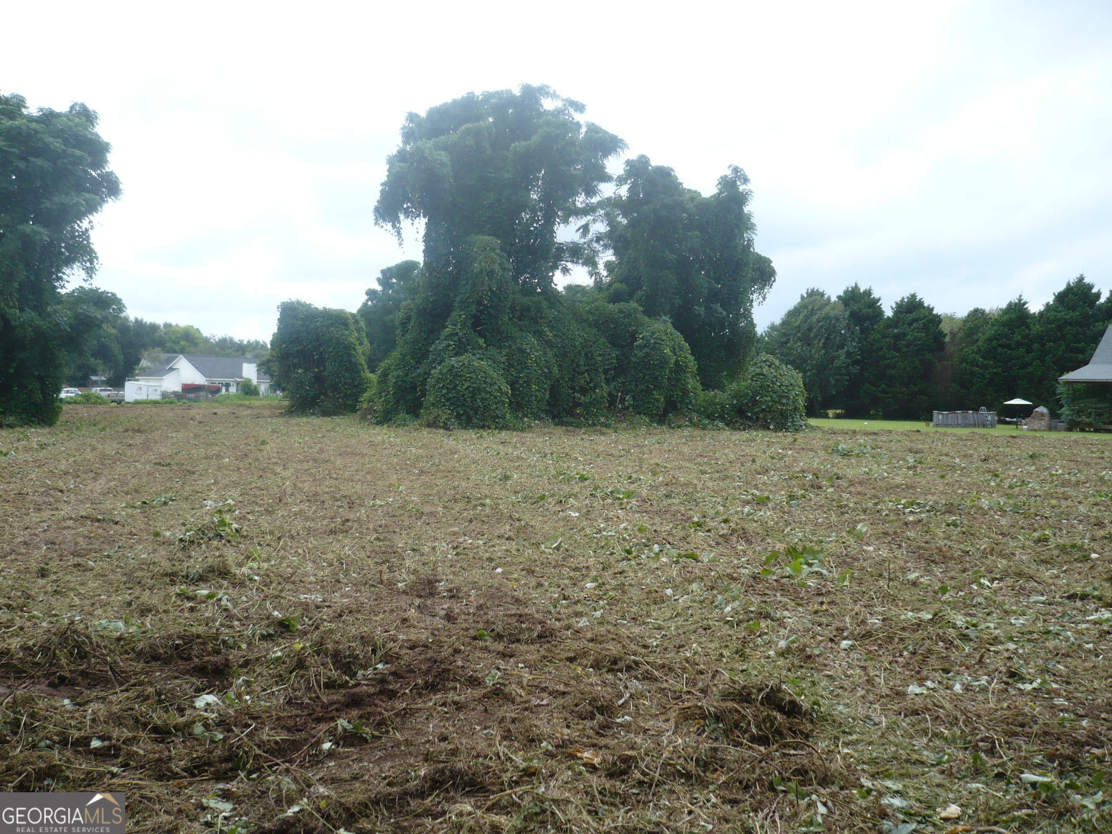 2284 Highway 41 Perry, GA 31069 - Photo 7 of 10 a view of a field with trees in background