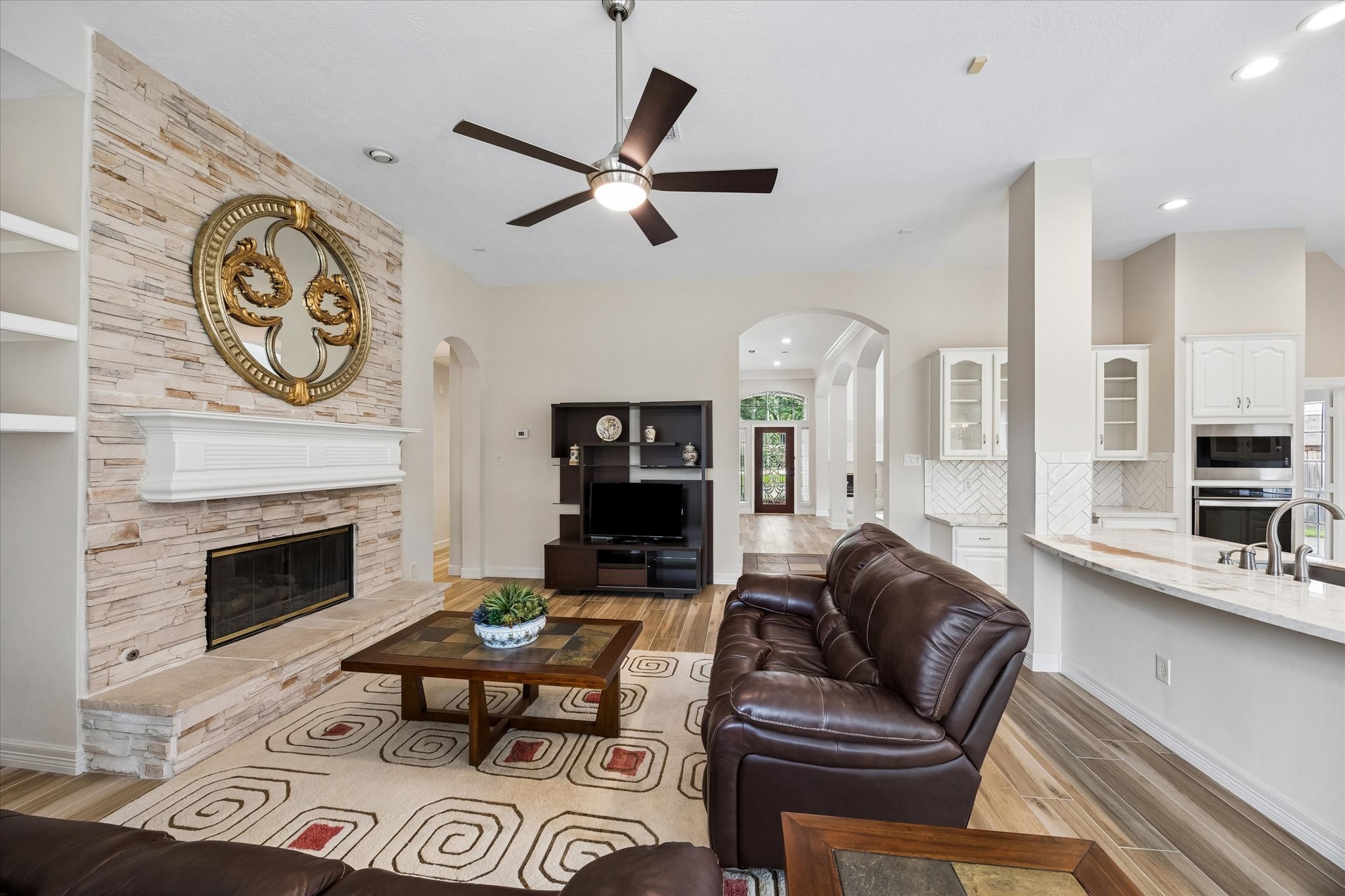 5306 Summerland Ridge Court Houston, TX 77041 - Photo 10 of 33 a living room with furniture and a fireplace