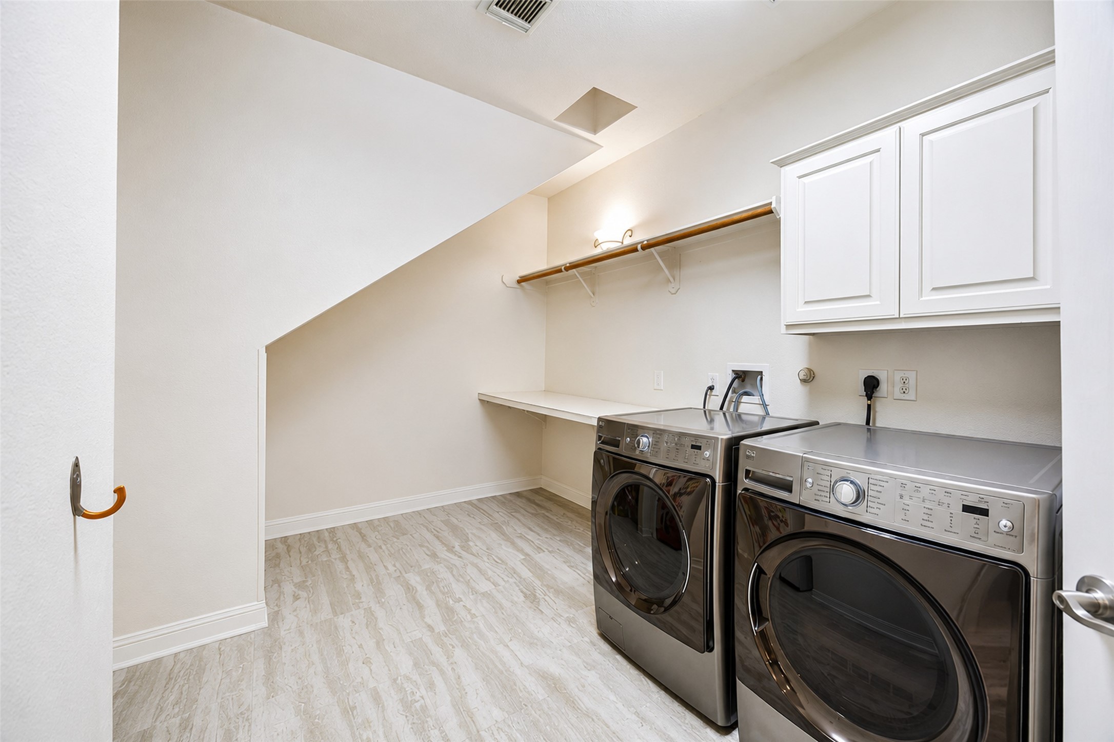 5718 Brennan Ridge Lane Katy, TX 77450 - Photo 22 of 42 ROOM TO ORGANIZE IT ALL: Rarely found and incredibly practical, this oversized laundry room offers extensive storage, abundant workspace, and the functionality designed to make everyday tasks easier and more efficient.