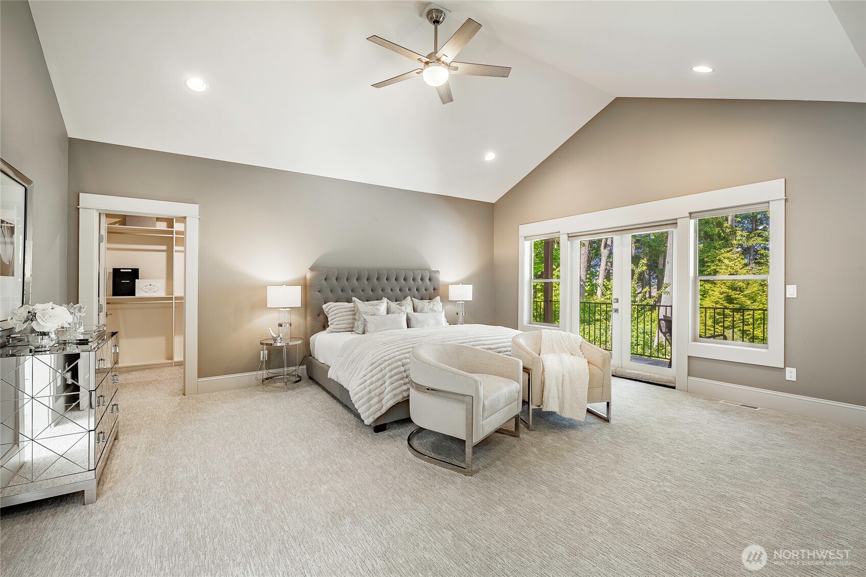 9125 Shearwater Road Blaine, WA 98230 - Photo 17 of 40 a bed room with a bed and a chandelier