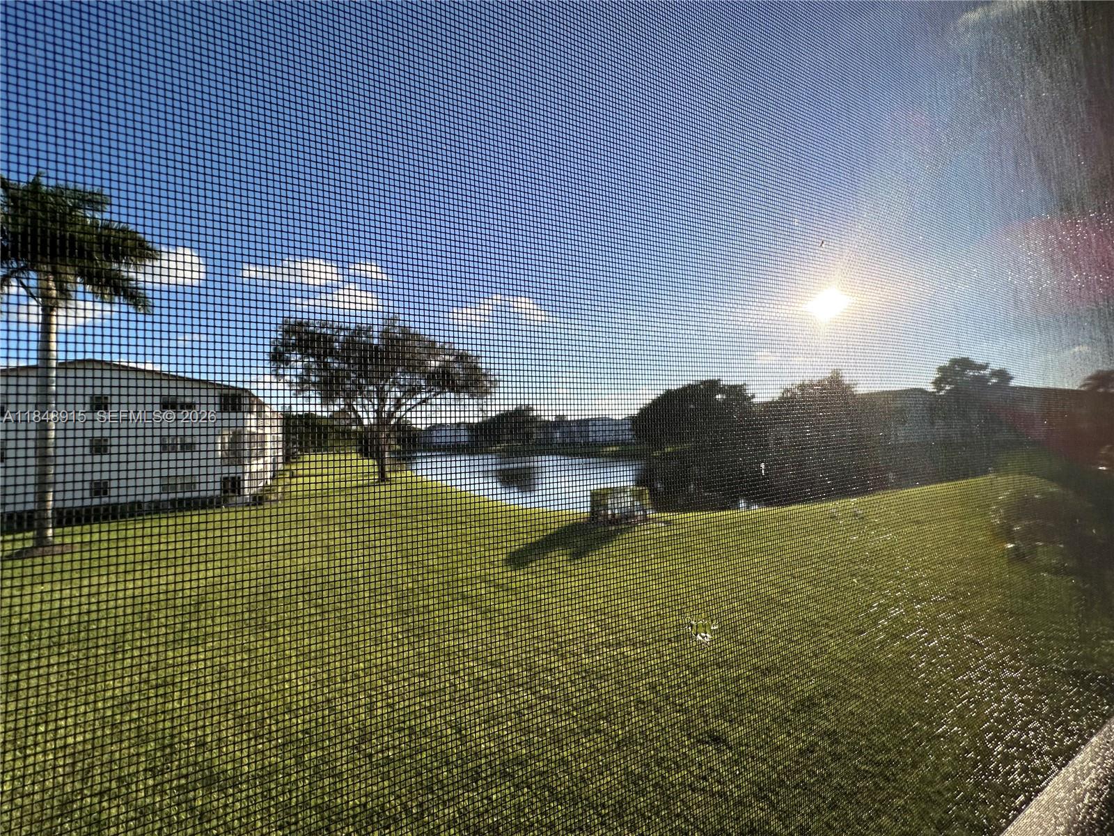 569 Fanshaw North, Unit 569 Boca Raton, FL 33434 - Photo 20 of 24 a view of residential houses with outdoor space