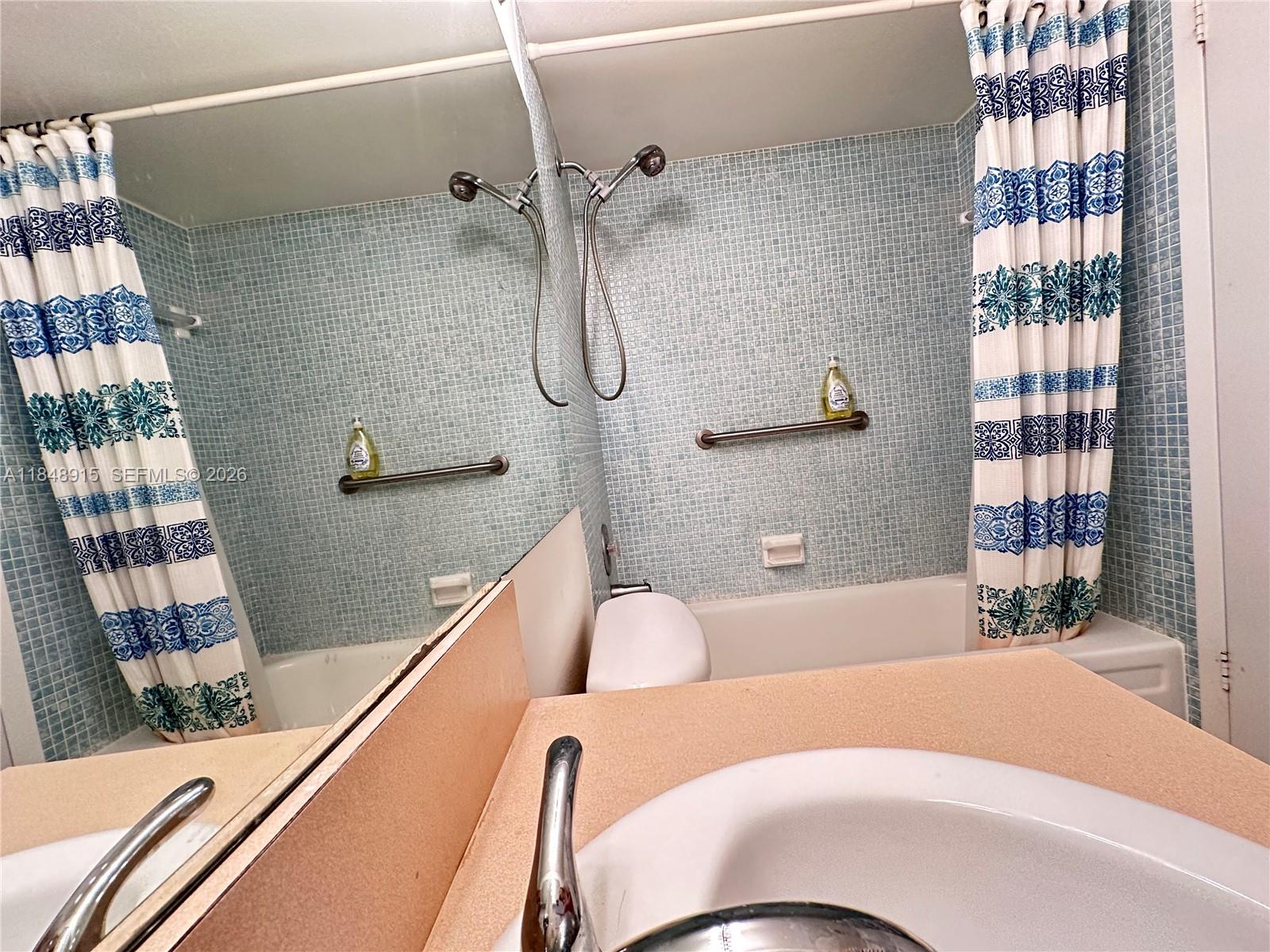 569 Fanshaw North, Unit 569 Boca Raton, FL 33434 - Photo 22 of 24 a bedroom with a bed and a window