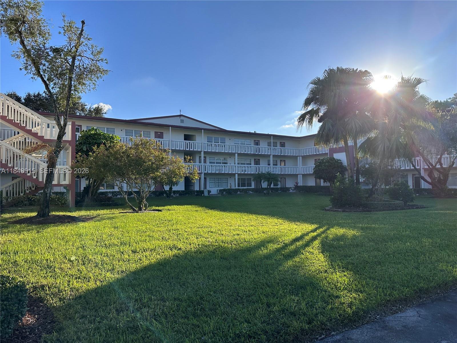 569 Fanshaw North, Unit 569 Boca Raton, FL 33434 - Photo 24 of 24 a view of a house with a yard