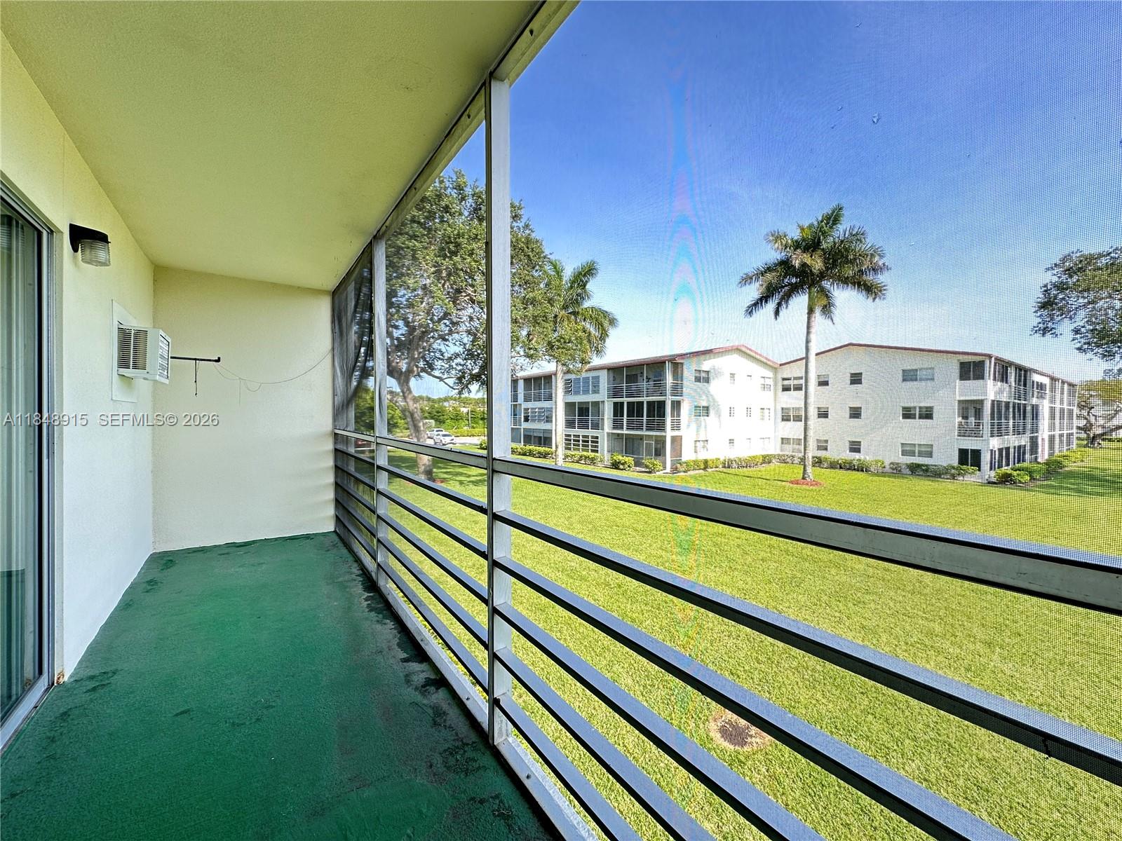 569 Fanshaw North, Unit 569 Boca Raton, FL 33434 - Photo 5 of 24 a view of house with swimming pool outdoor seating