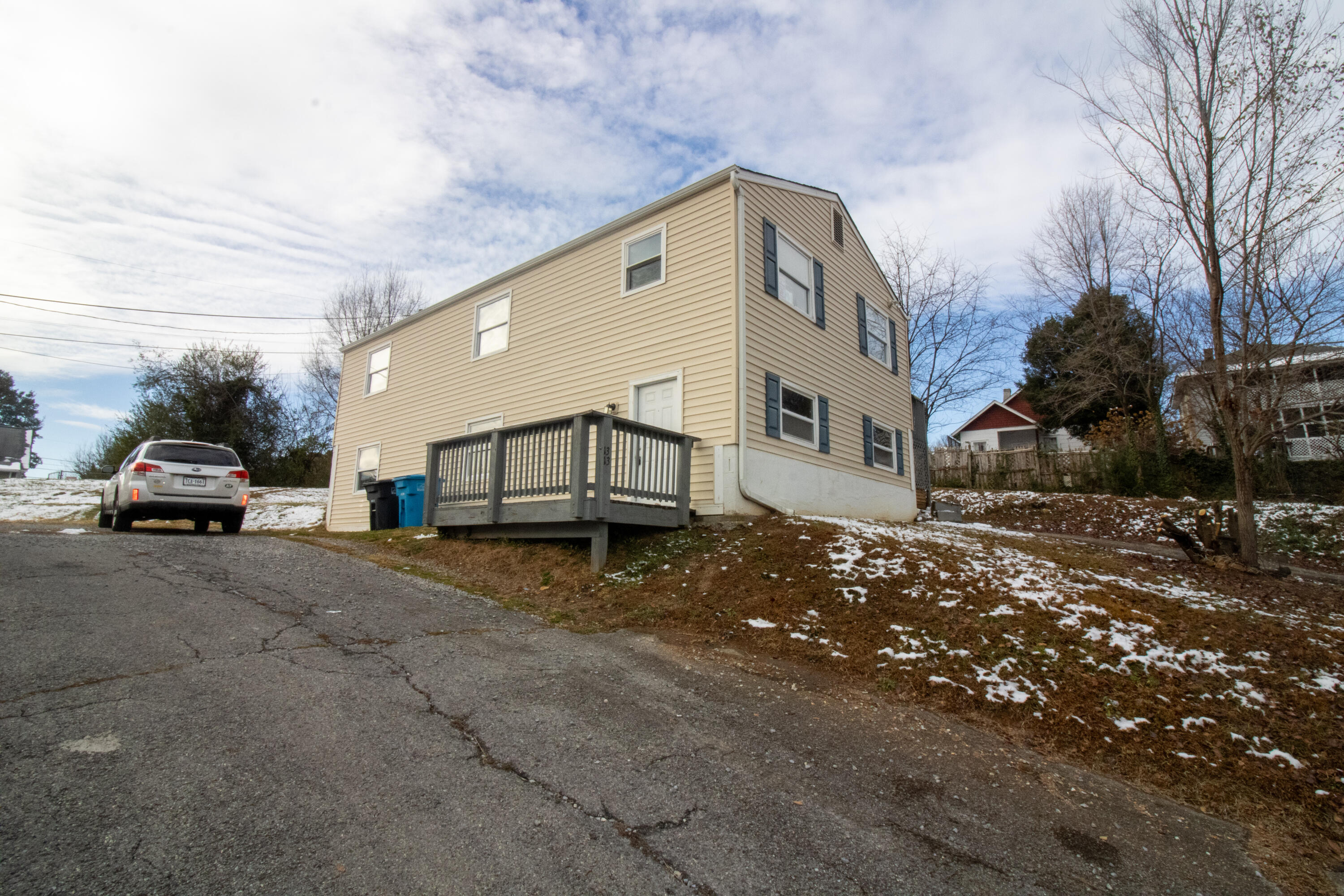 a view of a car park in front of house