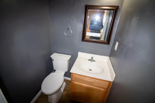 a bathroom with a toilet and a sink
